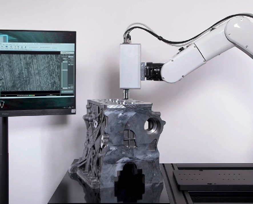 Image of a robotic arm with a surface measurement sensor from GBS Metrology, measuring the roughness of a surface.